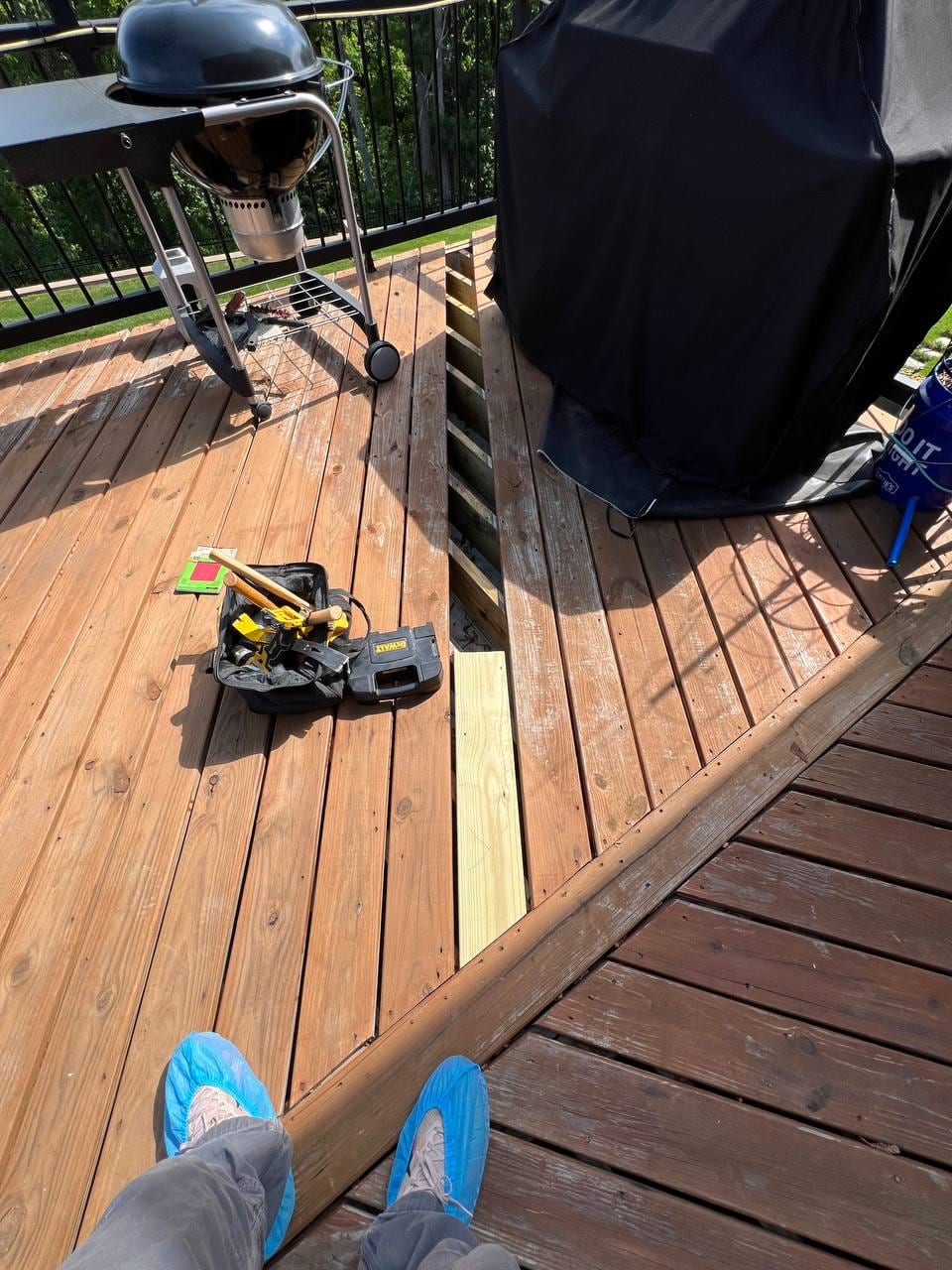 Deck repair in progress with a new board being fitted