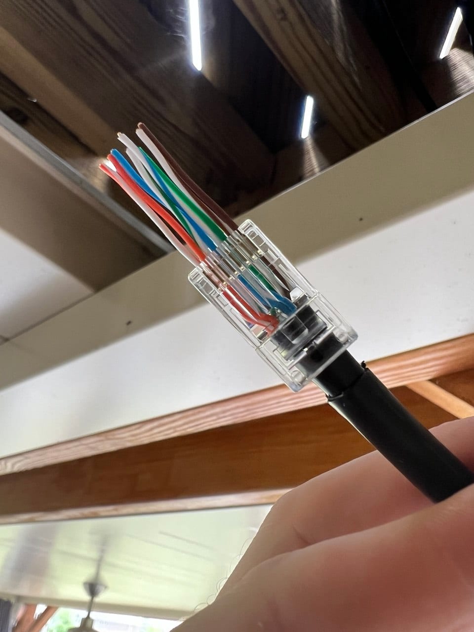 Hand-terminated Cat6 Ethernet cable with a pass-through RJ45 connector
